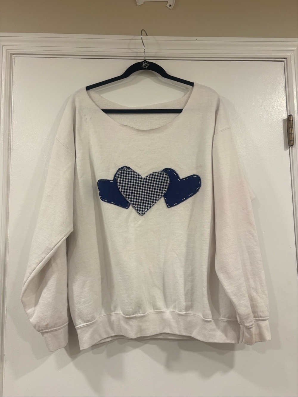 White Sweatshirt with Navy Heart Appliqués